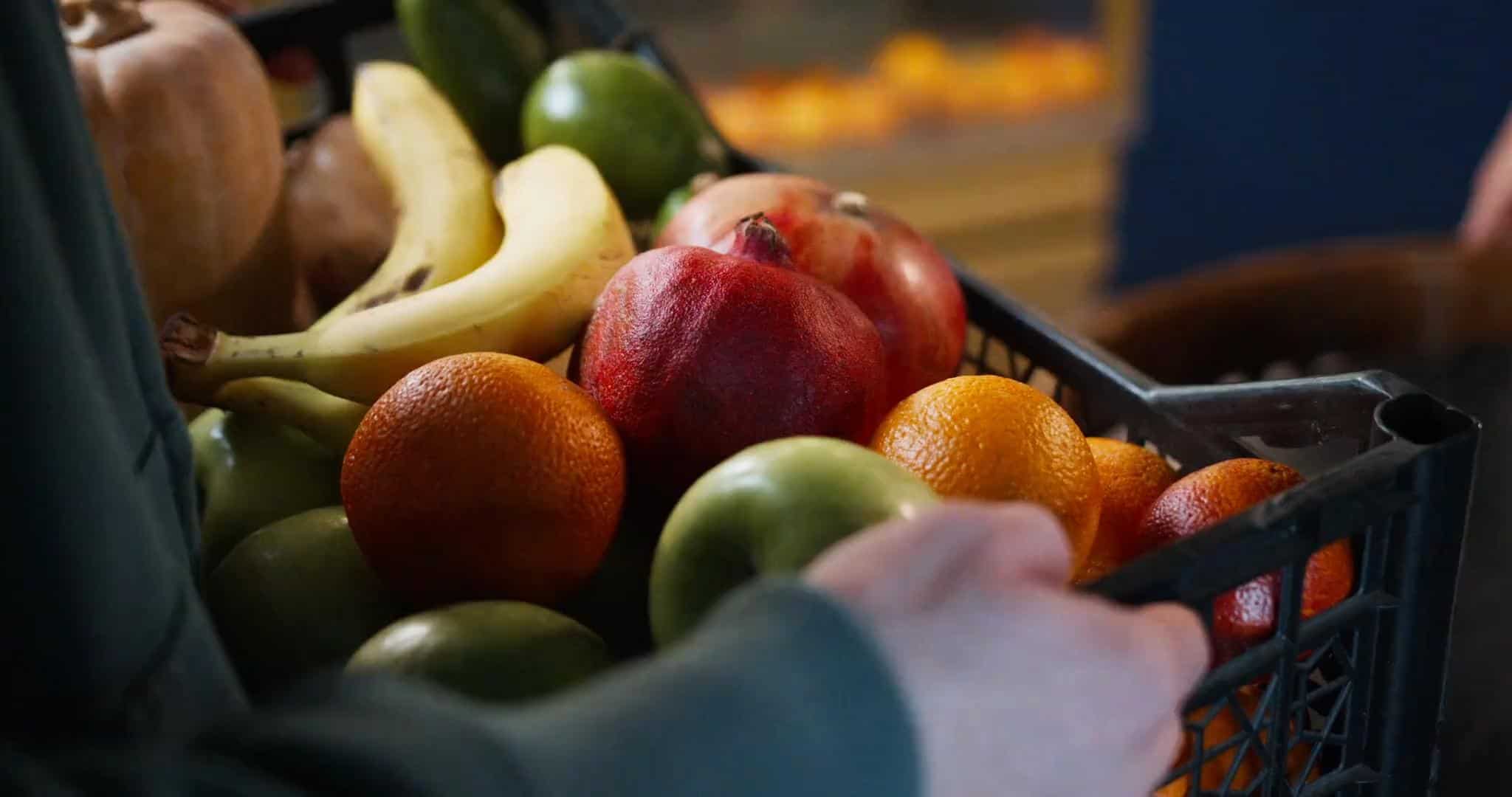Fresh fruit basket with apples, bananas, oranges, and other seasonal fruits for healthy eating. Perf.